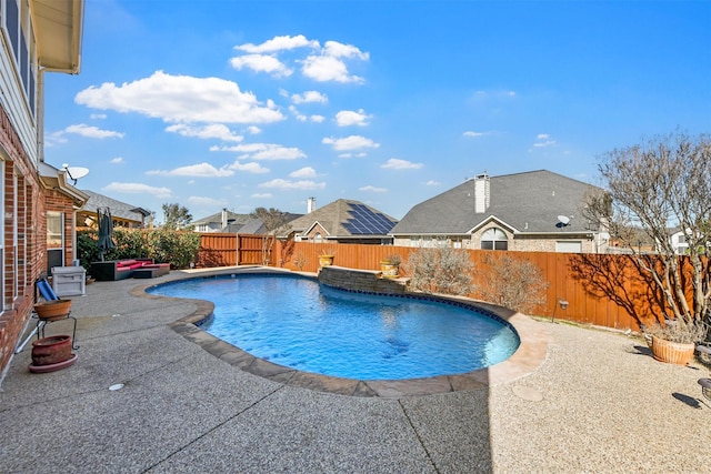 view of swimming pool featuring a fenced in pool, a fenced backyard, and a patio