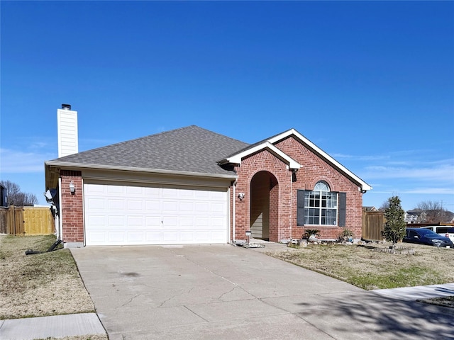 ranch-style home with driveway, a chimney, fence, and brick siding