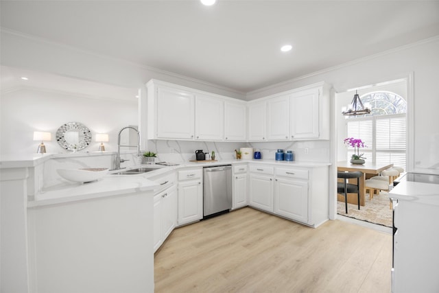 kitchen featuring a sink, light wood-type flooring, ornamental molding, and dishwasher