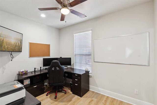 office with light wood-style flooring, baseboards, and a ceiling fan