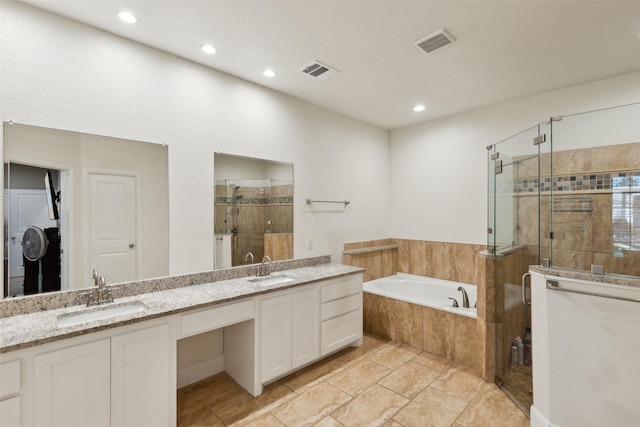 full bath featuring a bath, a stall shower, a sink, and visible vents