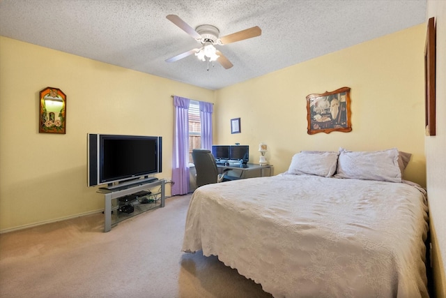 carpeted bedroom featuring a textured ceiling, a ceiling fan, and baseboards