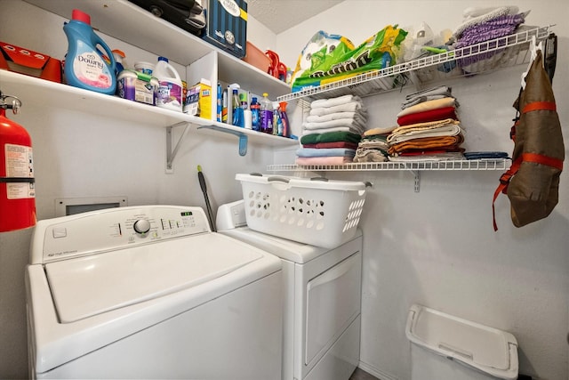 clothes washing area featuring laundry area and independent washer and dryer