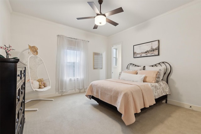 bedroom with light carpet, baseboards, a ceiling fan, and crown molding