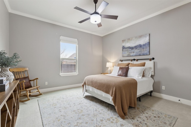 bedroom with carpet floors, ornamental molding, baseboards, and ceiling fan