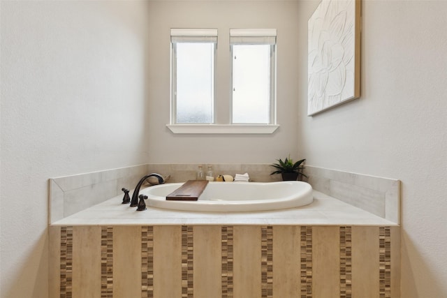 bathroom with a garden tub