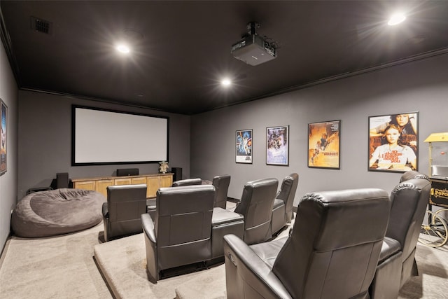 home theater room with light carpet, ornamental molding, visible vents, and recessed lighting