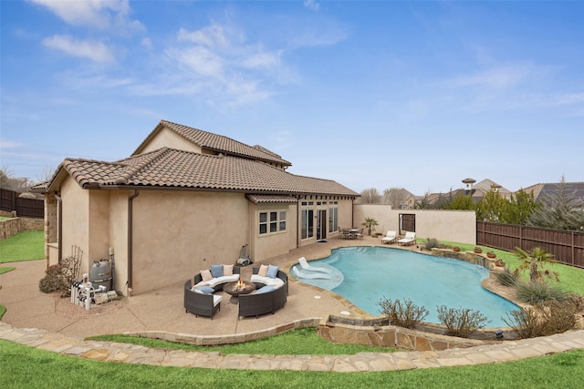 view of swimming pool with a patio, an outdoor fire pit, a fenced backyard, and a fenced in pool