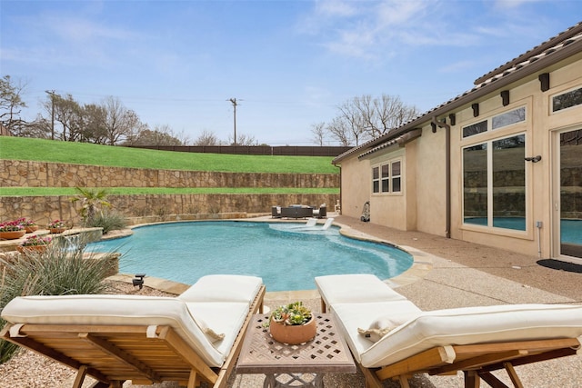 view of swimming pool featuring a patio, fence, and a fenced in pool