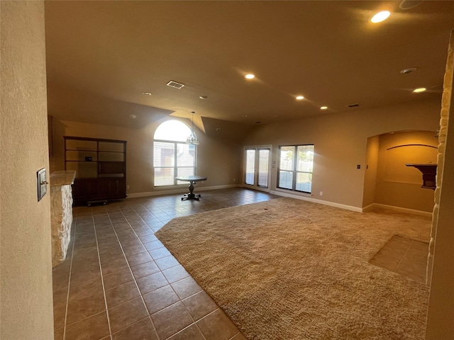 tiled empty room featuring baseboards, visible vents, and recessed lighting