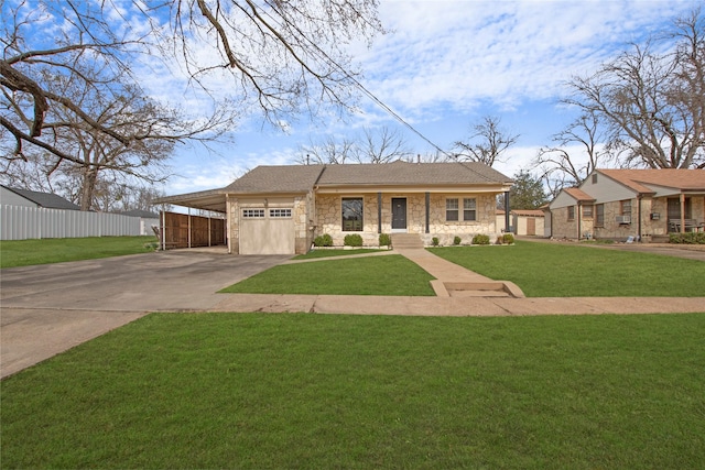 view of front of property featuring a garage, fence, driveway, stone siding, and a front yard