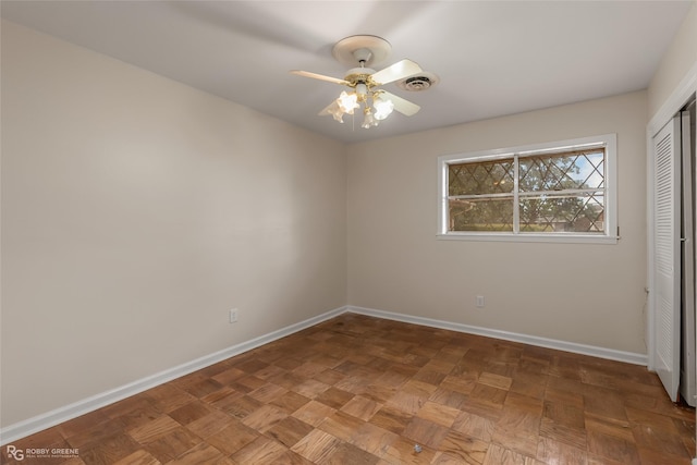 unfurnished bedroom featuring a closet, visible vents, ceiling fan, and baseboards