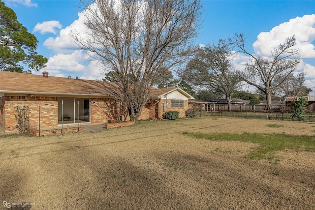 view of yard featuring a patio area and fence