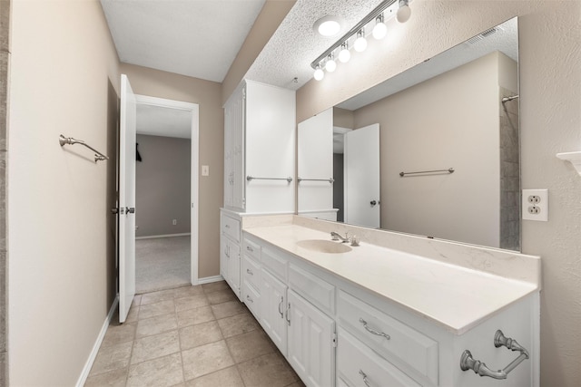 bathroom featuring vanity, visible vents, and baseboards