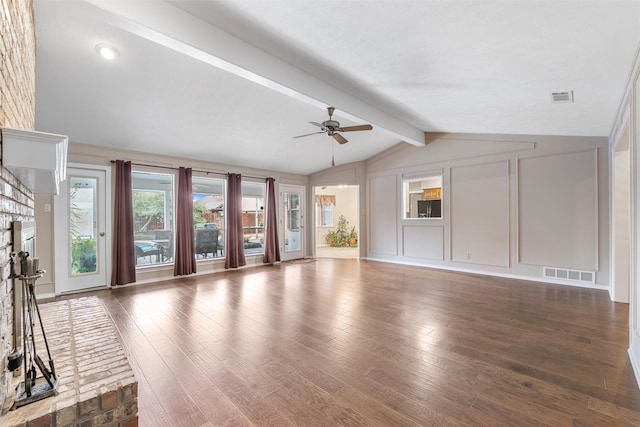 unfurnished living room with lofted ceiling with beams, ceiling fan, dark wood-type flooring, and visible vents