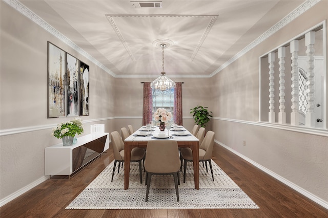 dining area featuring baseboards, a chandelier, vaulted ceiling, and wood finished floors