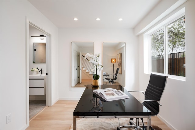 office with baseboards, light wood-style floors, and recessed lighting