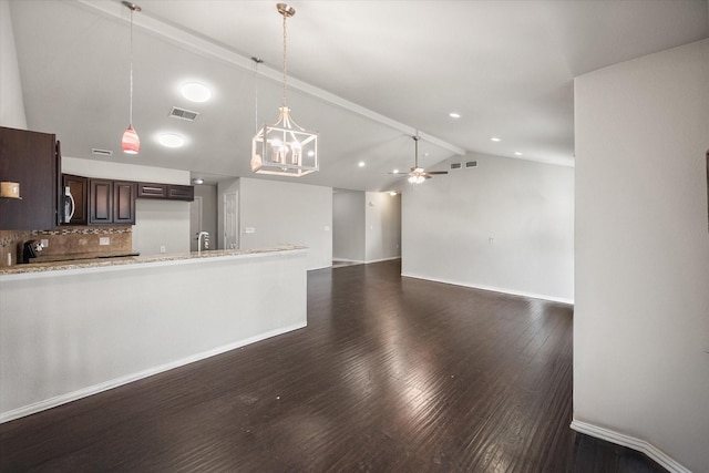 kitchen featuring dark wood-type flooring, visible vents, a ceiling fan, vaulted ceiling, and dark brown cabinets