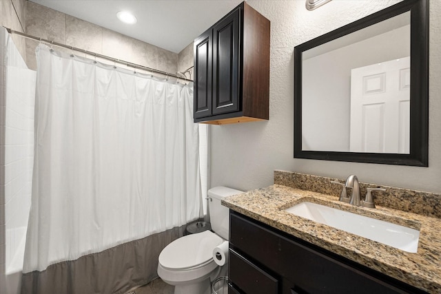 full bath with toilet, shower / bathtub combination with curtain, and vanity