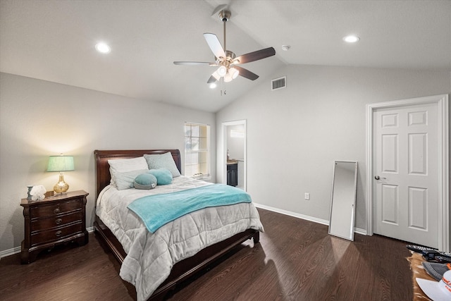 bedroom featuring baseboards, visible vents, vaulted ceiling, and wood finished floors