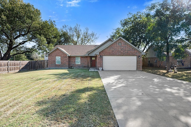 ranch-style house with a garage, brick siding, fence, driveway, and a front lawn