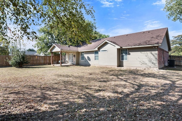 back of property featuring brick siding, a patio area, a fenced backyard, and central air condition unit