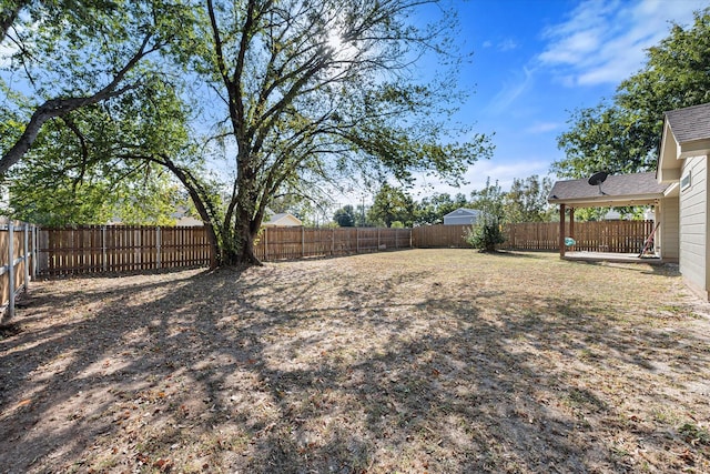 view of yard with a fenced backyard