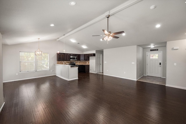 unfurnished living room featuring ceiling fan, vaulted ceiling with beams, baseboards, and wood finished floors