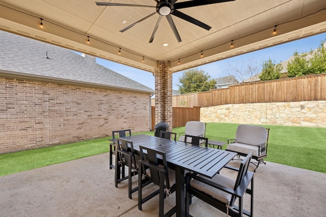 view of patio / terrace with outdoor dining space, fence, and ceiling fan