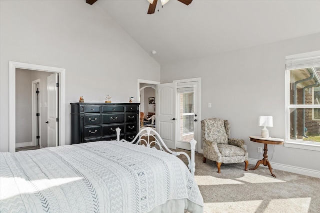 carpeted bedroom with ceiling fan, high vaulted ceiling, and baseboards