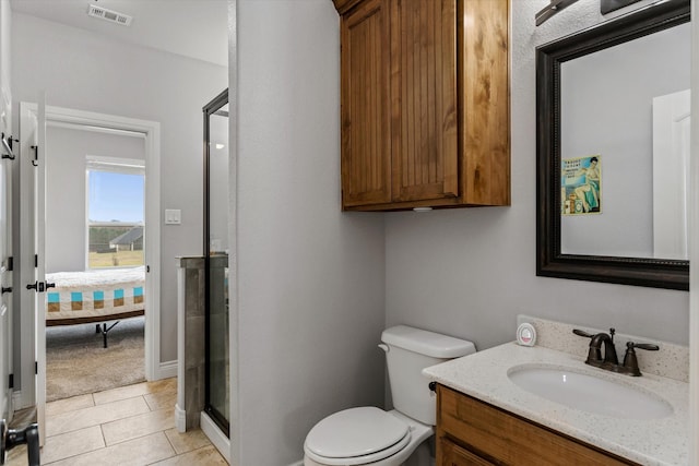 ensuite bathroom with visible vents, toilet, tile patterned floors, vanity, and a shower stall