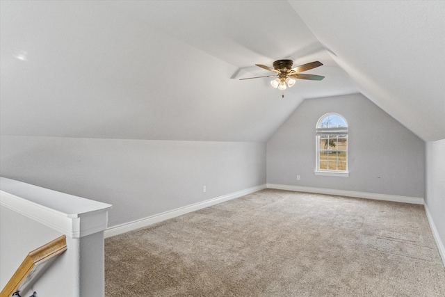 additional living space with a ceiling fan, baseboards, vaulted ceiling, and carpet flooring