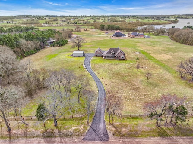 birds eye view of property with a rural view and a water view