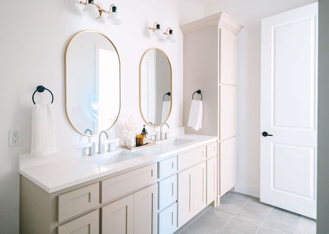 full bathroom with tile patterned floors, a sink, and double vanity