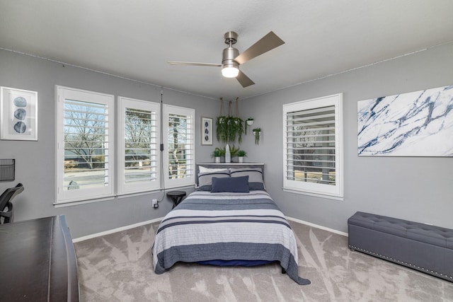 bedroom with carpet, ceiling fan, and baseboards