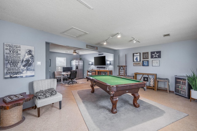 game room with attic access, visible vents, a textured ceiling, and pool table