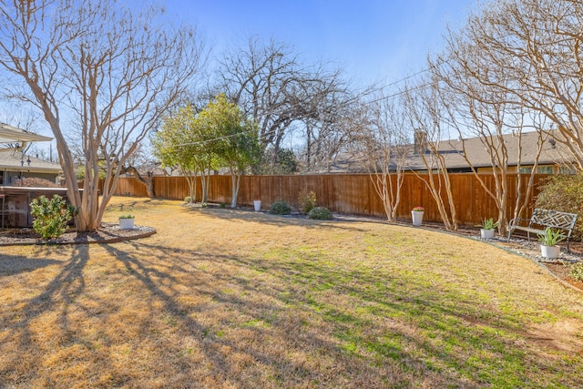 view of yard featuring a fenced backyard