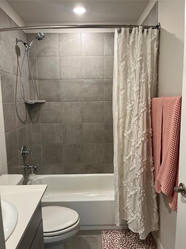 full bathroom with shower / bathtub combination with curtain, toilet, and vanity