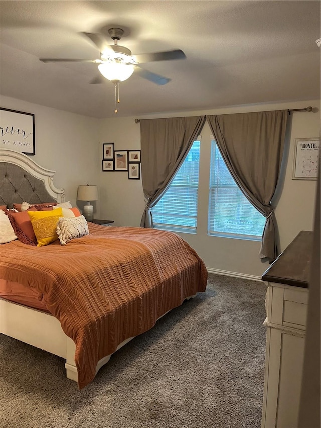 bedroom with carpet floors, baseboards, and a ceiling fan