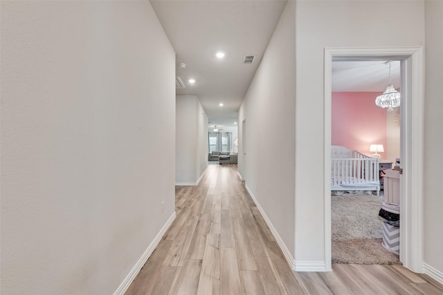 6116 Pathfinder Trl, Fort Worth, TX 76179 - hallway featuring light wood-style flooring, baseboards, recessed lighting, and a chandelier