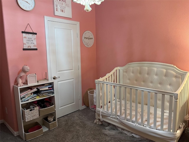 carpeted bedroom with a crib