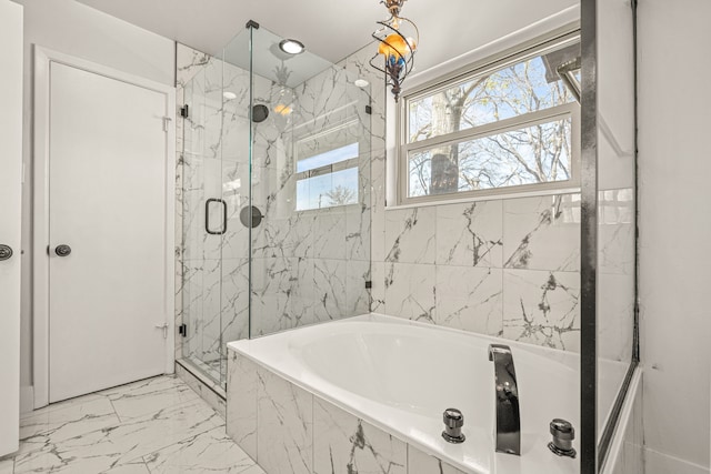 full bath featuring marble finish floor, a marble finish shower, and a bath