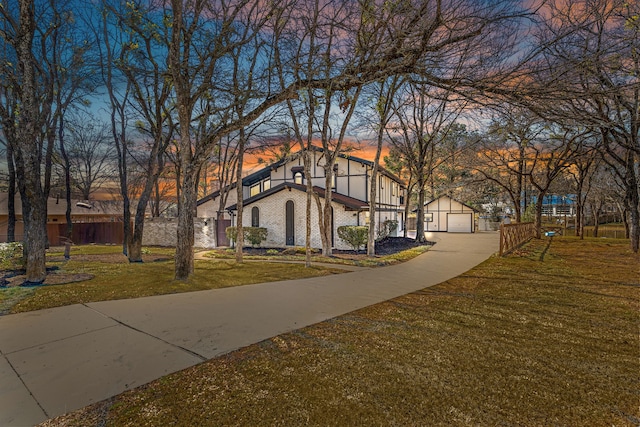 view of community featuring a garage and a lawn