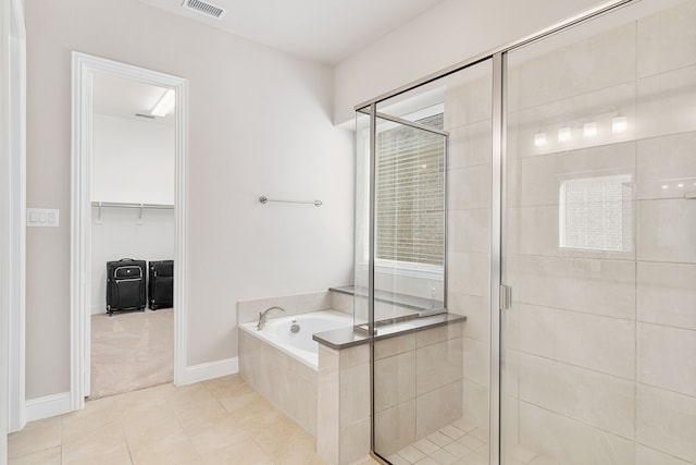 full bath with a stall shower, a garden tub, visible vents, and tile patterned floors