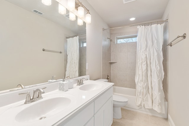 full bath with double vanity, shower / bath combo with shower curtain, a sink, and visible vents