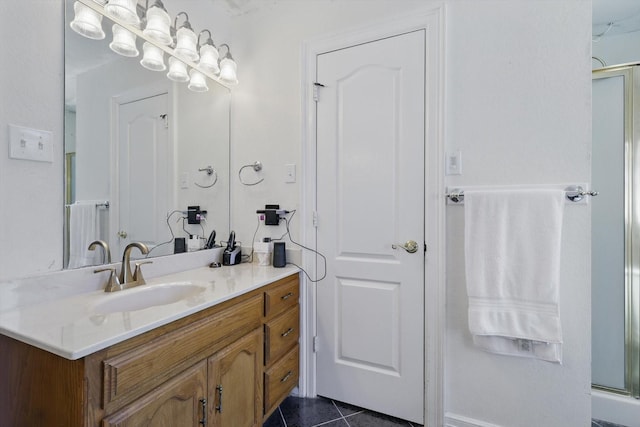 full bath featuring tile patterned flooring, vanity, and a shower with shower door