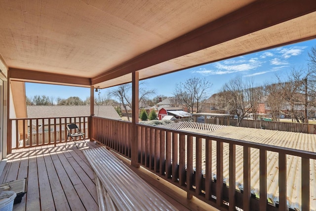 wooden terrace featuring a residential view