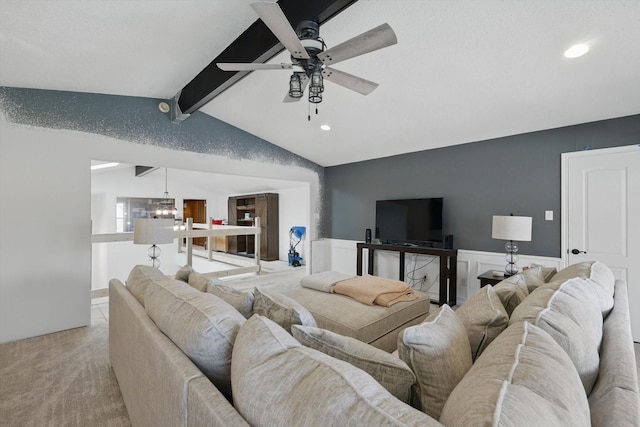 living room featuring vaulted ceiling with beams, ceiling fan, light colored carpet, wainscoting, and recessed lighting