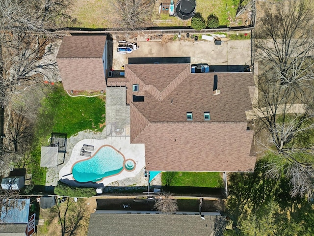 aerial view of property and surrounding area with a pool area