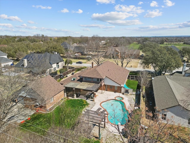 aerial view of residential area featuring a pool
